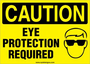 OSHA-style Caution eye protection required sign for jobsite safety and hazard awareness