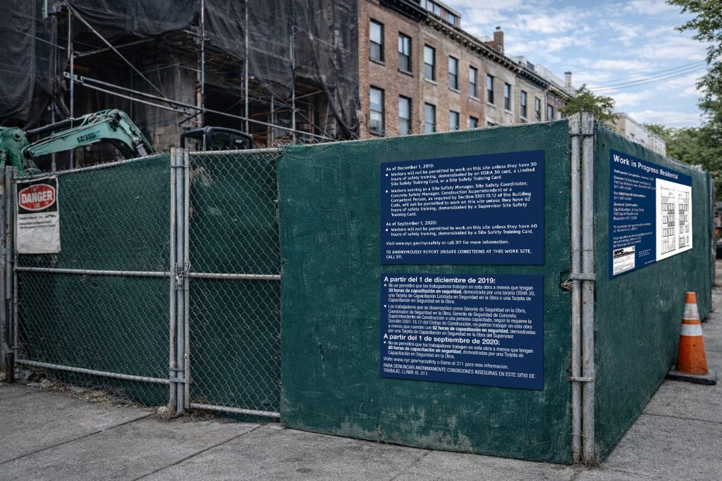 NYC SST site safety training sign posted on construction fence